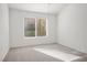 Bright bedroom featuring neutral walls, plush carpeting, and a window offering natural light at 9001 Marble Dr, Las Vegas, NV 89134