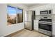 This bright kitchen features new stainless steel appliances and a view to the street at 9001 Marble Dr, Las Vegas, NV 89134