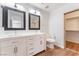 Bathroom featuring double vanity sinks, and a separate closet at 9124 Palatial Palette Ct, Las Vegas, NV 89149