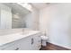 Bathroom featuring a single vanity with a white countertop, modern fixtures, and wood-look flooring at 9124 Palatial Palette Ct, Las Vegas, NV 89149