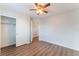 Clean bedroom with wood floors and an open closet at 9124 Palatial Palette Ct, Las Vegas, NV 89149