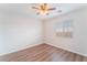 Clean bedroom with wood floors and a window at 9124 Palatial Palette Ct, Las Vegas, NV 89149