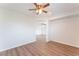 Hallway features wood flooring and arched doorway with a glimpse into another room at 9124 Palatial Palette Ct, Las Vegas, NV 89149