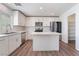 Modern kitchen with stainless steel appliances, white cabinets, and center island at 9124 Palatial Palette Ct, Las Vegas, NV 89149