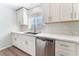 Well-lit kitchen with white cabinets, modern appliances, and stainless steel dishwasher at 9124 Palatial Palette Ct, Las Vegas, NV 89149