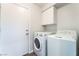 Laundry room with white washer and dryer at 9124 Palatial Palette Ct, Las Vegas, NV 89149