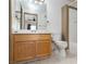 Bathroom featuring a wooden vanity, large mirror, and a shower/tub combo with tile surround at 924 Angel Star Ln, Las Vegas, NV 89145