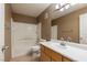 Bathroom featuring a tiled shower and a vanity sink, designed for both functionality and style at 924 Angel Star Ln, Las Vegas, NV 89145