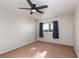 Bedroom with neutral carpet and a ceiling fan offers a relaxing retreat at 924 Angel Star Ln, Las Vegas, NV 89145