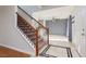 Entryway with tile floor, wood staircase with black iron spindles, and neutral paint at 924 Angel Star Ln, Las Vegas, NV 89145