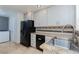 Kitchen featuring sleek black appliances and ample cabinet space, complemented by granite countertops at 924 Angel Star Ln, Las Vegas, NV 89145