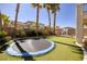 Backyard featuring a trampoline, lawn, plants and perimeter fencing at 9379 Arrowhead Bluff Ave, Las Vegas, NV 89149