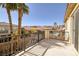 Balcony with views of the backyard, palm trees, and neighboring homes at 9379 Arrowhead Bluff Ave, Las Vegas, NV 89149