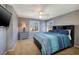 Cozy bedroom featuring a ceiling fan, dresser, and lots of natural light at 9379 Arrowhead Bluff Ave, Las Vegas, NV 89149