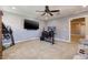 Large bonus room is well-lit with ceiling fan and neutral carpeting at 9379 Arrowhead Bluff Ave, Las Vegas, NV 89149