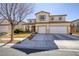 Charming two-story home featuring a stucco exterior, tile roof, three car garage and well-maintained landscaping at 9379 Arrowhead Bluff Ave, Las Vegas, NV 89149