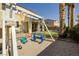 play area includes swing set and lush landscaping in backyard at 9379 Arrowhead Bluff Ave, Las Vegas, NV 89149