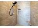 Modern shower with a handheld showerhead and built-in niche at 9379 Arrowhead Bluff Ave, Las Vegas, NV 89149