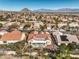 A picturesque aerial shot of a house showcasing the backyard patio and surrounding neighborhood at 9809 Gerald Ct, Las Vegas, NV 89134