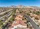 A captivating aerial view of the home, nestled in a serene neighborhood with mountain views at 9809 Gerald Ct, Las Vegas, NV 89134