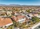 A panoramic aerial view of the home's backyard, community landscaping and mountain view at 9809 Gerald Ct, Las Vegas, NV 89134