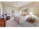 Comfortable bedroom featuring neutral decor, plush carpeting, and a ceiling fan at 9809 Gerald Ct, Las Vegas, NV 89134