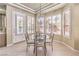 Cozy breakfast nook with a glass table and lots of natural light streaming through plantation shutters at 9809 Gerald Ct, Las Vegas, NV 89134