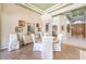 Elegant dining room with a chandelier, ornate decor, and a view into the living area at 9809 Gerald Ct, Las Vegas, NV 89134