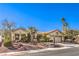 Inviting single-story home featuring lush landscaping, a well-manicured lawn, and a welcoming facade at 9809 Gerald Ct, Las Vegas, NV 89134