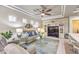 Cozy living room featuring a ceiling fan, recessed lighting, and a comfortable sofa at 9809 Gerald Ct, Las Vegas, NV 89134