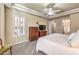 Another view of this main bedroom shows a tv, drawers, and more beautiful plantation shutters at 9809 Gerald Ct, Las Vegas, NV 89134