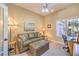 This home office features a comfy couch, lots of natural light, and functional decor at 9809 Gerald Ct, Las Vegas, NV 89134