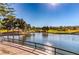 Scenic pond view with lush green golf course and clear blue sky in the background at 9809 Gerald Ct, Las Vegas, NV 89134