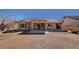 Extended covered patio on a home with low-maintenance landscaping and mature trees at 9912 Woodhouse Dr, Las Vegas, NV 89134