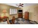 Comfortable bedroom with shutters features a ceiling fan, and a large chest of drawers at 9912 Woodhouse Dr, Las Vegas, NV 89134