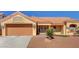 Charming single-story home featuring a two-car garage and well-maintained desert landscaping at 9912 Woodhouse Dr, Las Vegas, NV 89134