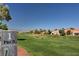 Golf course Par 5 sign with green fairway and blue sky in the background at 9912 Woodhouse Dr, Las Vegas, NV 89134