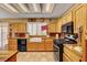 Modern kitchen with light-colored cabinets and tile backsplash at 9912 Woodhouse Dr, Las Vegas, NV 89134