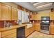 Kitchen featuring light cabinets, updated appliances, and tile floors at 9912 Woodhouse Dr, Las Vegas, NV 89134