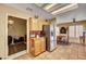 Kitchen with stainless steel refrigerator adjacent a cozy living area at 9912 Woodhouse Dr, Las Vegas, NV 89134