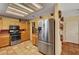 Modern kitchen with light-colored cabinets and stainless steel refrigerator at 9912 Woodhouse Dr, Las Vegas, NV 89134