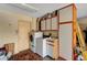 Well-equipped laundry room with modern washer and dryer, storage cabinets, and a wash basin at 9912 Woodhouse Dr, Las Vegas, NV 89134