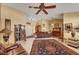 Spacious living room with tile flooring, ceiling fan, and traditional furnishings at 9912 Woodhouse Dr, Las Vegas, NV 89134