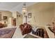 Open concept living room with tile floor and leather furniture at 9912 Woodhouse Dr, Las Vegas, NV 89134