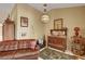 Living room featuring a leather couch, an antique rug and a vintage chandelier at 9912 Woodhouse Dr, Las Vegas, NV 89134