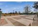 Recreational shuffleboard courts with mature trees in the background at 9912 Woodhouse Dr, Las Vegas, NV 89134