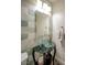 Chic powder room with vessel sink and decorative tile accent wall at 1125 Via Canale Dr, Henderson, NV 89011