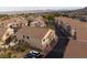 Aerial view of residential neighborhood showcasing townhouses, streets, and desert landscape in the distance at 1292 Large Cap Dr # 3, Henderson, NV 89074