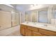 Bright bathroom showcasing double sinks, a large mirror, and a shower/tub combo at 1292 Large Cap Dr # 3, Henderson, NV 89074