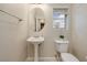 Charming bathroom showcasing a pedestal sink and a window at 1292 Large Cap Dr # 3, Henderson, NV 89074